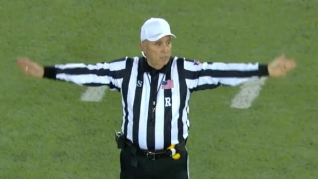 An official makes a call at the First Responder Bowl.
